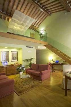 2 person deluxe suite and 1 child with city view, king bed, an extra bed, private facilities (bath and shower), and breakfast